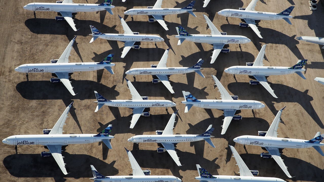 An aerial view of decommissioned and suspended jetBlue commercial aircrafts are seen stored in Pinal Airpark in Marana, Arizona, USA.